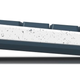 A side profile shot of the Freewrite Alpha distraction-free digital typewriter showing how thin it is, plus its adjustable stand.